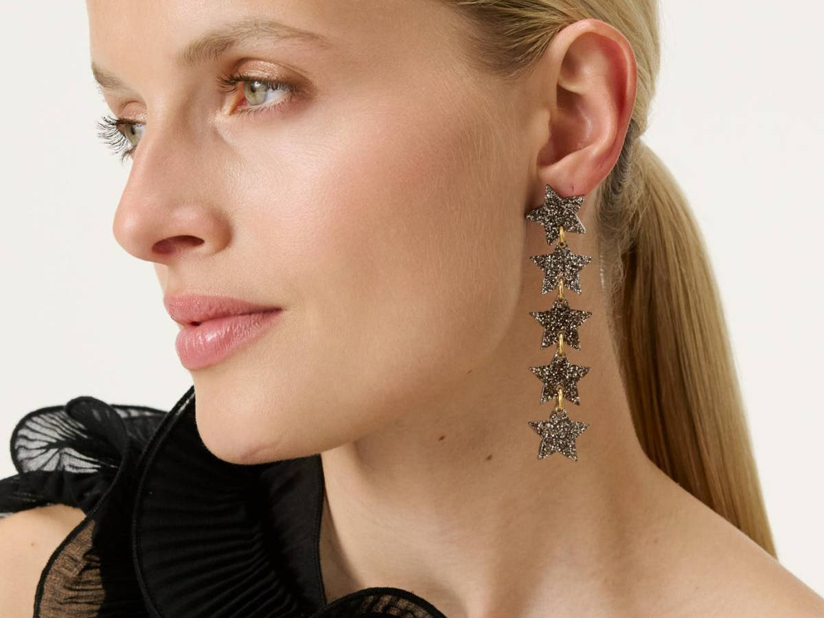 Statement drop earrings worn on a model on GLAMBOU CH